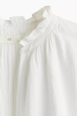 Frill-trimmed cotton blouse